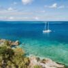 Aerial view of Waltzing Matilda anchored in a turquoise Whitsunday bay