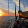 Guests on deck watching the sunset from Waltzing Matilda
